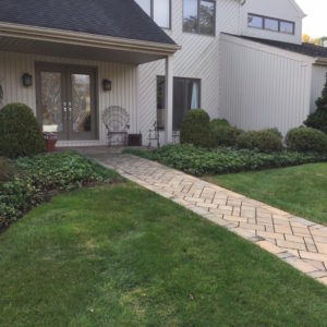 Cement pavers come in many different colors and styles that can make a dramatic entranceway to any home.