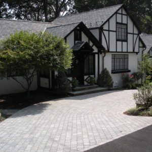 This driveway was installed using a cement paver that resembles natural cobblestone.