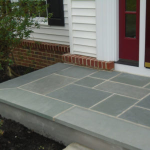Natural bluestone was used to resurface this existing concrete step.