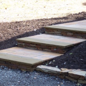 These natural sandstone steps allows for a compfortable grade change.