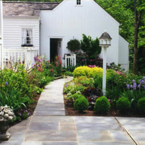This country garden was designed to allow for easy access. The plantings chosen provide color and texture to the landscape.