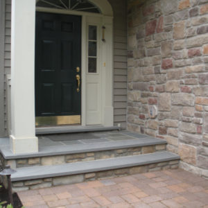 Existing concrete steps were resurfaced using a stone veneer and natural Pennsylvania bluestone.