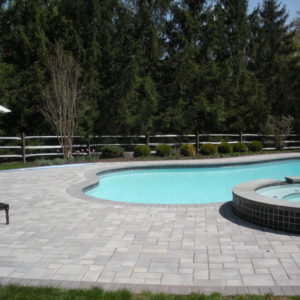 This paver patio with raised spa allows ample room for entertainment.