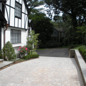 This sloping paver driveway adds elegance to the home.