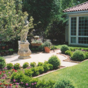 This Mediterranean garden design compliments the style of the home.