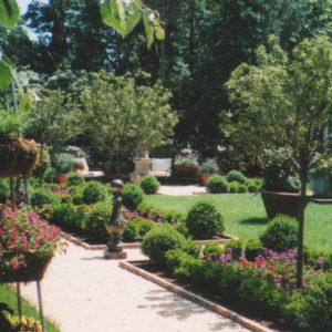 This gravel path design leads you through a formal Mediterranean garden.