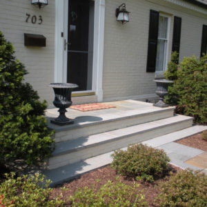 These large bluestone capped front entrance stairs allow for an inviting entrance.