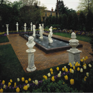 This formal raised pond encompassed by a paver walkway allows you to view all angles of the sculptures while enjoying the spring bloom.