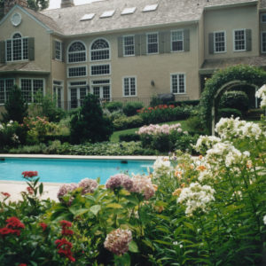 Using the right plants will offer many different colors and textures throughout the pool season.