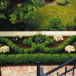 This formal scroll garden was designed to be enjoyed from the view of the terrace, and becomes a focal point in the landscape.