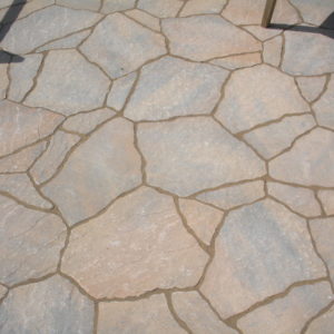 This irregular cement paver creates a patio with a natural stone look.