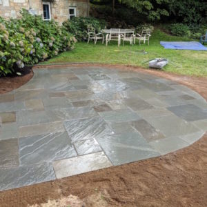 This small curved dry laid Pennsylvania bluestone patio creates the perfect space for entertaining.