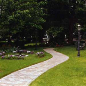 This winding paver path allows one to stroll through the landscape.