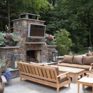 This custom built natural stone fireplace creates a great outdoor living space to relax and entertain.